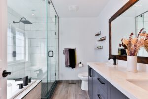 a modern-looking bathroom with dark wooden tile