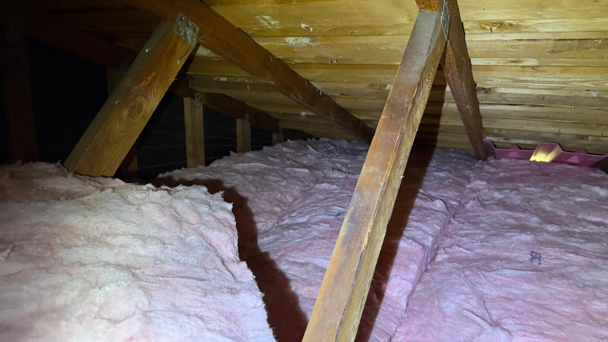 New pink batts between the trusses, with a pink baffle at the eave