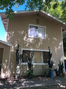 Two-story home exterior after a fresh coat of paint