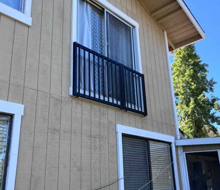 Repainted siding and trim on a two-story home