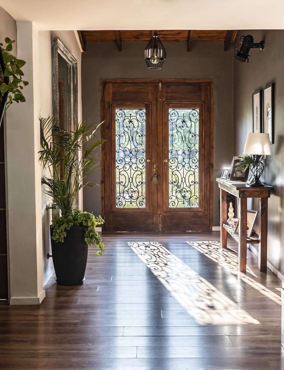 View of a trendy wooden front door from the inside